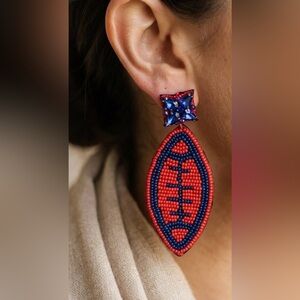 festive “Mud Pie” Red and Blue Beaded football Drop Earrings.